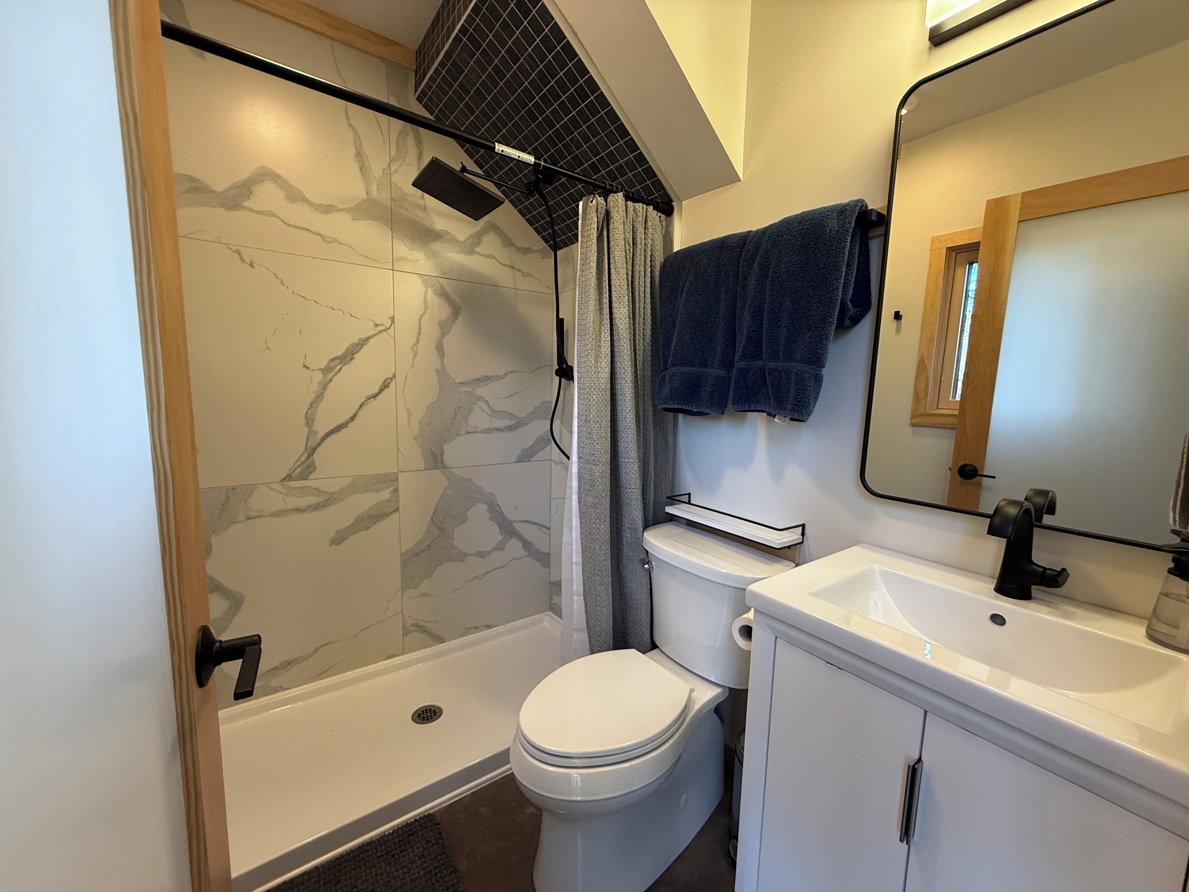 Shower, towels, soap, toilet paper
