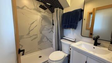 Shower, towels, soap, toilet paper