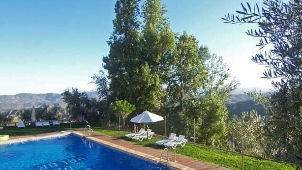 A swimming pool with a view of mountains in the background. - Ländliches Haus mit Jacuzzi by Interhome (Valor)