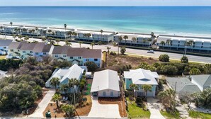 A coastal residential area with beachfront properties, including houses and a hotel with a beach view. - Seashellin' - Short walk to beach (Panama City Beach)