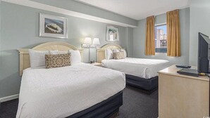 A hotel room with two beds, a desk with a computer, a TV, and two bedside lamps. - Spacious 3-bedroom condo at Grande Shores inn serene Myrtle Beach (Myrtle Beach)