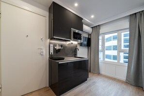 Fridge, microwave, stovetop, coffee/tea maker - 301 — SB20 Boutique Studios | 1BR | 1BA | W/K (Madrid)