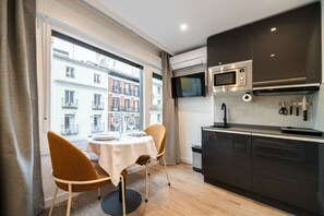 Fridge, microwave, stovetop, coffee/tea maker - 302 — SB20 Boutique Studios | 1BR | 1BA | W/K (Madrid)