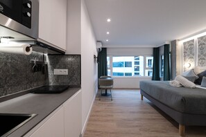 Fridge, microwave, stovetop, coffee/tea maker - 303 — SB20 Boutique Studios | 1BR | 1BA | W/K (Madrid)