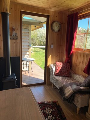 TV, fireplace - Foxes Cove Shepherds Hut, Porthcothan Retreats by the beach nr Padstow, Cornwall (Padstow)