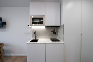 Fridge, microwave, stovetop, coffee/tea maker - 305 — SB20 Boutique Studios | 1BR | 1BA | W/K (Madrid)