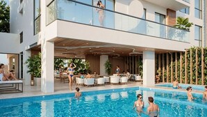 Um hotel moderno com área de piscina, espaço para sentar ao ar livre e um alpendre coberto.