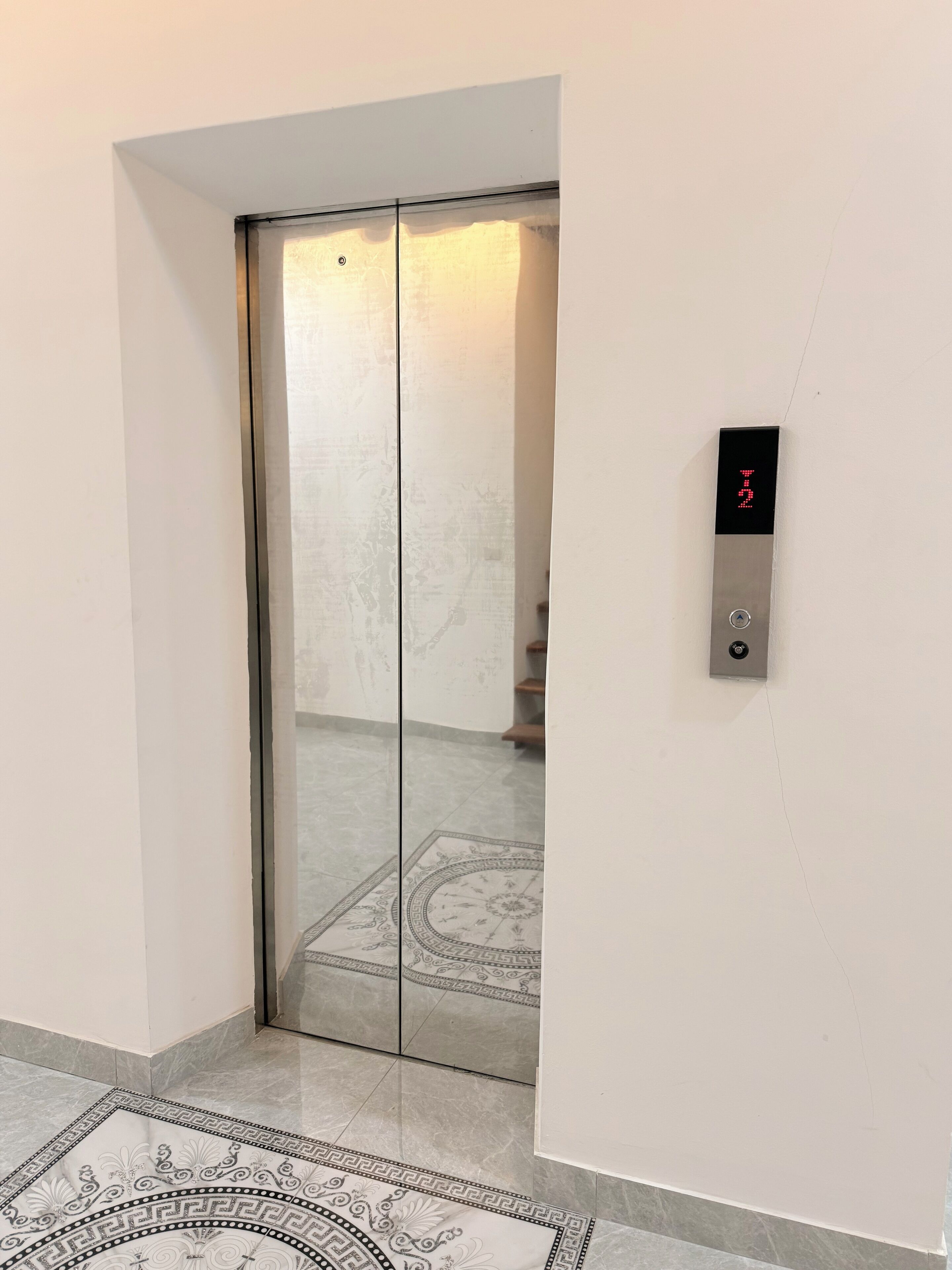 An elevator with a digital display showing the number 2.