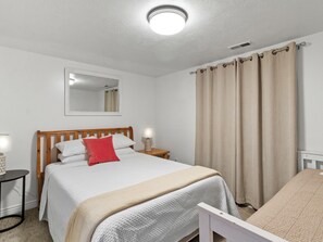 Bedroom 5, downstairs, Queen bedroom with single bed located at the bottom of the stairs apart from the main downstairs sleeping area, sleeps up to 3 people. - Grand Mountain Retreat: Hot Tub, Sauna, Sleeps 21, Sofa Sleeper on Main Floor (Draper)