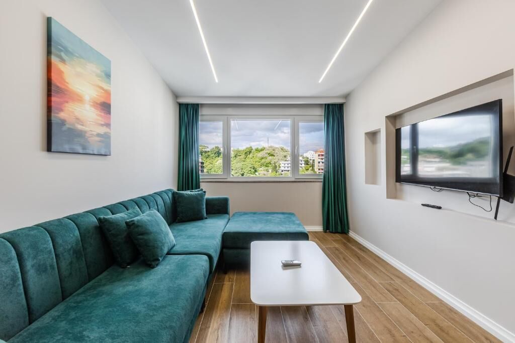 Family Apartment, Hill View | Living area | Flat-screen TV