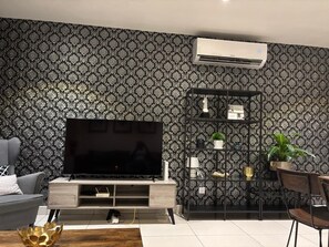 Apartamento Deluxe, vistas a la ciudad | Zona de estar