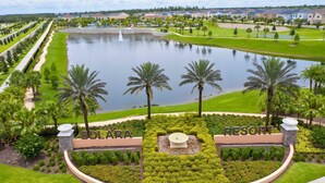 A resort with a large central pond, palm trees, and well-maintained lawns. - 9096 Amazing house 6/5 W/Pool Solara Resort (Kissimmee)