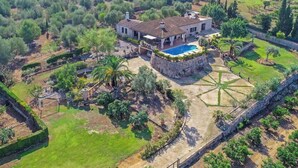A large house with a swimming pool, surrounded by lush greenery and a well-maintained garden. - Blaypetit by Interhome (Muro)