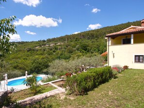 A house with a swimming pool, surrounded by greenery and hills. - House 2036 by Interhome (Rabac)