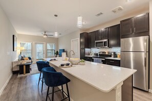 Microwave, oven, stovetop, dishwasher - Modern McKinney 1BR, Pool View + Park View, Easy Hwy Access (McKinney)