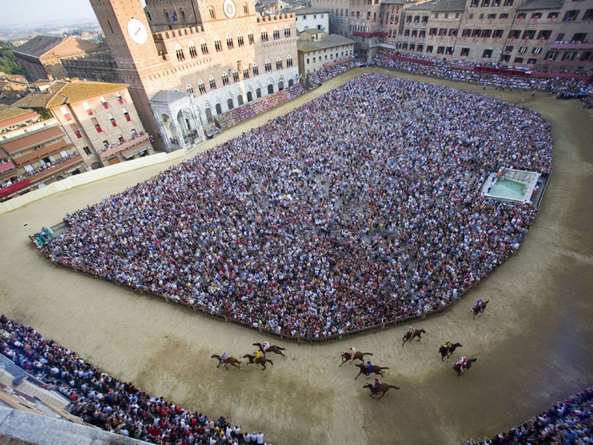 A large open square surrounded by historic buildings, likely a public square or plaza.