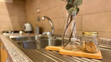 Fridge, oven, cookware/dishes/utensils