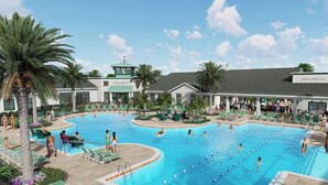 A swimming pool area with multiple pools, lounge chairs, and palm trees.
