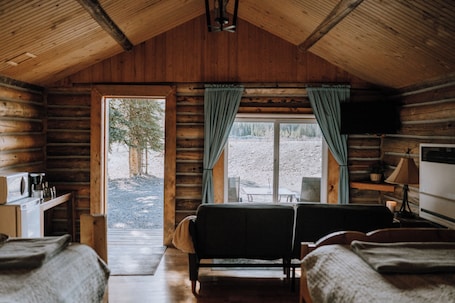 Deluxe Cabin, Patio, Mountain View | Living area. The Lodge at Panther River