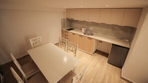 A compact kitchen with a white countertop, wooden cabinets, a stainless steel sink, and a built-in dishwasher. - Duplex City 05 in Durr s (Durrës)