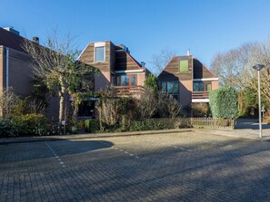 A residential area with two houses, paved driveway, and a street lamp. - Vestingsplek by Interhome (Veere)