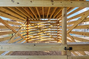 A wooden structure with a crisscross pattern of beams and a metal gate. - Private Hot Tub Condo with Panoramic Lake View, Free Tickets, Game & Fitness Rooms,Cmty Amenities (Kimberling City)