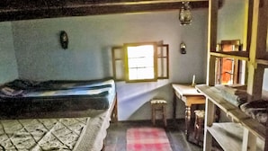A room with a bed, a desk, a chair, and a window. - Cozo Fantu by Interhome (Vale)