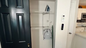 A compact kitchen with a microwave, oven, and a small countertop. - Casita Cortes is quiet, cozy and centrally located in Tampa. (Tampa)