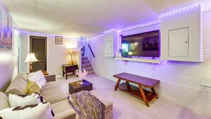 A living room with a sofa, coffee table, and TV. - Pet Friendly, Private! Multi-Level Brookline Home (Pittsburgh)