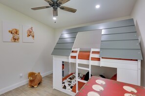 A child's bunk bed with a sloped roof, a ceiling fan, and two wall-mounted animal paintings. - Hike & Fish! Tyler Family Home 11 Mi to State Park (Tyler)