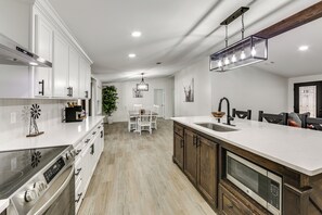 Fridge, microwave, stovetop, coffee/tea maker