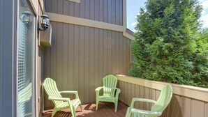 A balcony with wooden flooring and a beige wall. - Walk to Golf Course! Clymer Summer Escape w/ Deck (Clymer)