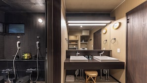 A modern bathroom with two sinks, a mirror, and a shower area. - Hakone Mori No Sato (Hakone)