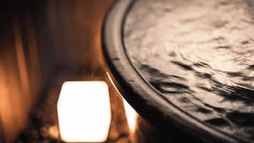 A close-up of a circular object with a textured surface, possibly a table or a part of a room's decor.