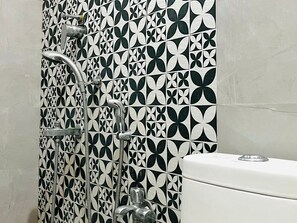 Shower, towels, soap, toilet paper