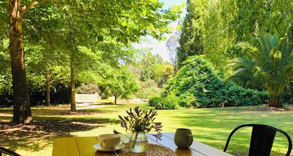 Secluded cottage with outdoor bath, river access, bikes, and farm animals.