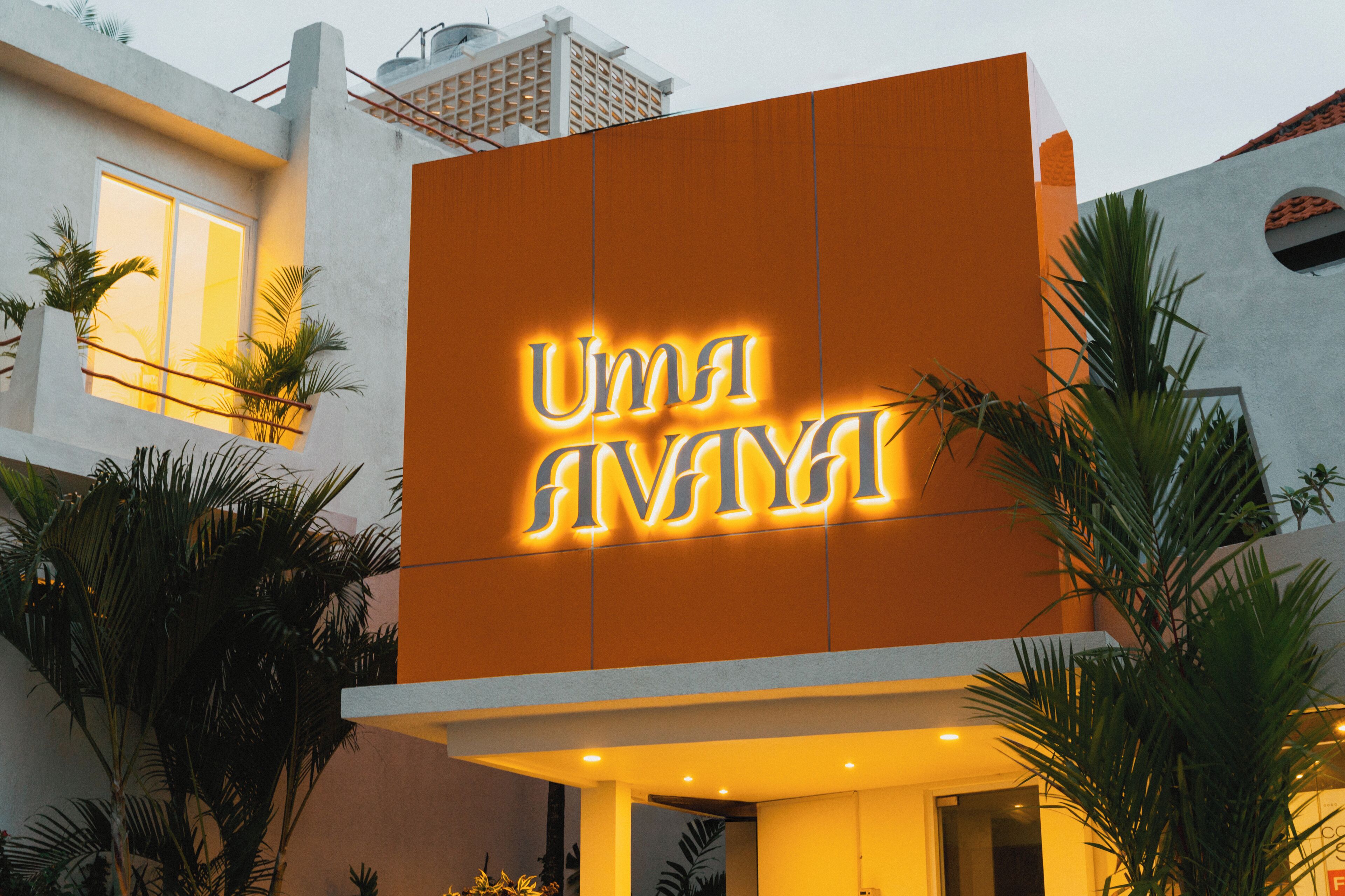 A building with a large illuminated sign reading "UMI ANAYA".