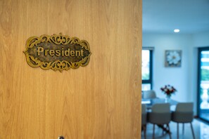 A wooden door with a brass plaque that reads 'President.' - Cannes Hotel (Phu Khuong)
