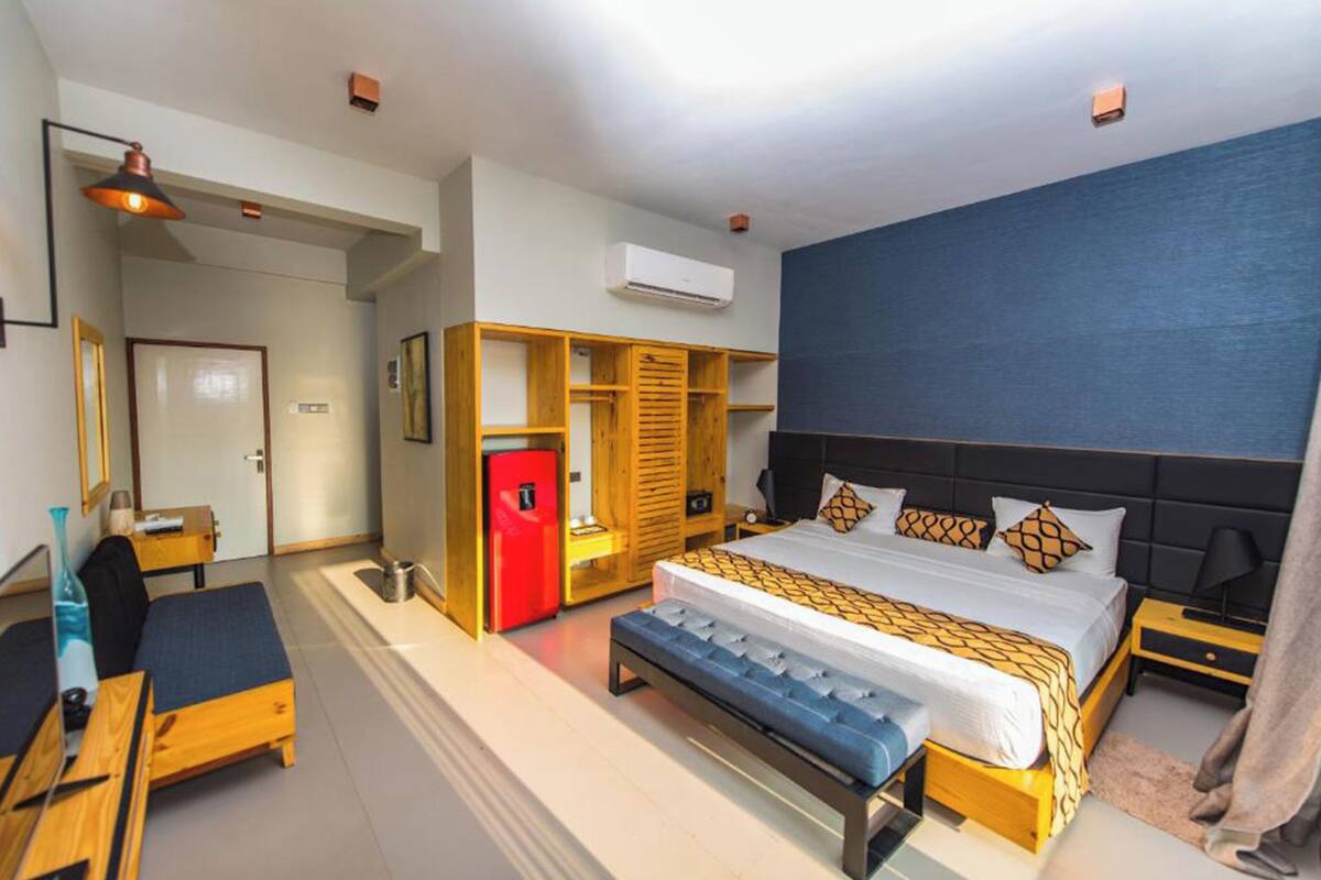 Deluxe Double Room, Balcony, Pool View | Desk, laptop workspace, WiFi (free), bed sheets