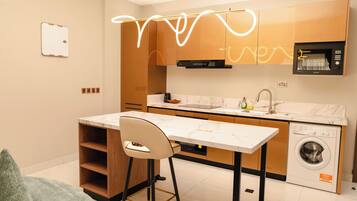 Comfort Apartment, Balcony, City View | Private kitchen | Full-size fridge, microwave, oven, stovetop