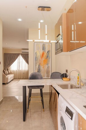 Basic Apartment, City View | Private kitchen | Full-sized fridge, microwave, oven, stovetop - Sterling Suites (Accra)