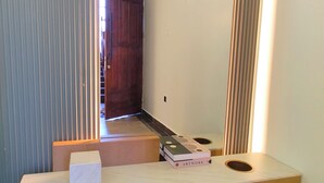 A modern bathroom with a marble countertop, a towel, and a book titled "ARTWORK". - Heritage Residences-Urban Ranger 1BR (Kampala)