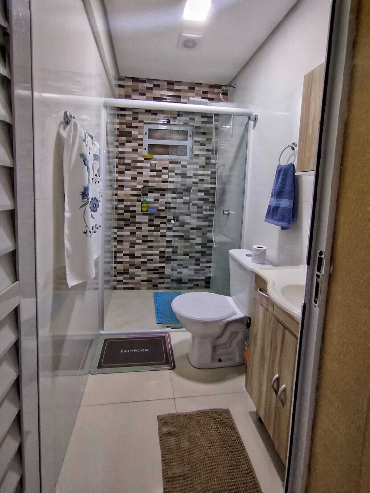 Shower, hair dryer, towels, toilet paper
