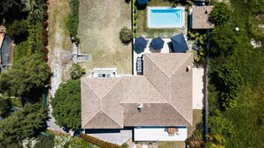 An aerial view of a property with a swimming pool, a covered patio, and a large house with a tiled roof. - Villa With Swimming Pool, Sauna, Fitness, sea View (Biot)