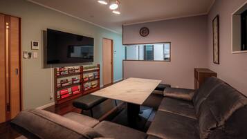 Superior House | Living area | 55-inch flat-screen TV with digital channels