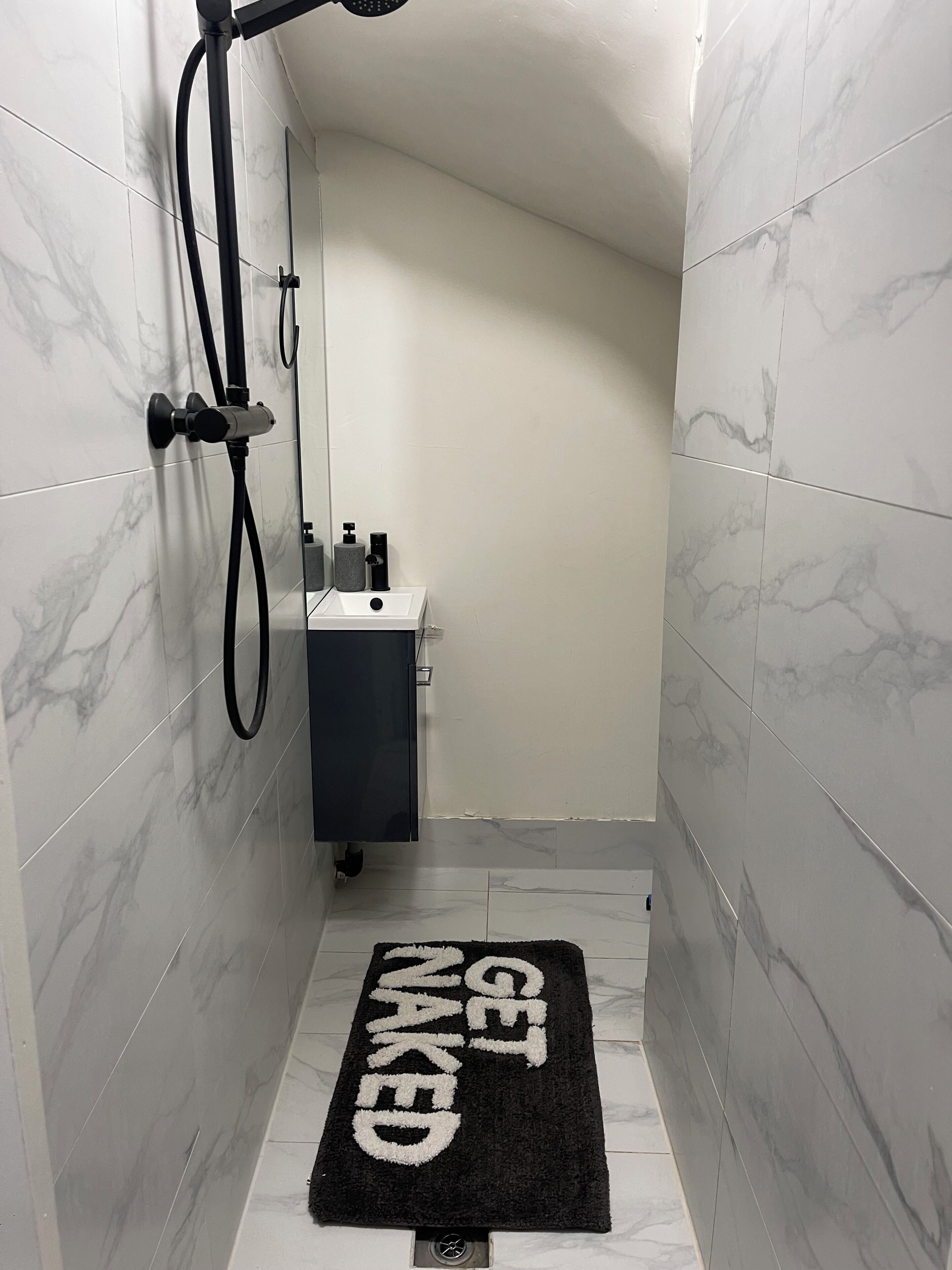 Shower, hair dryer, towels, toilet paper