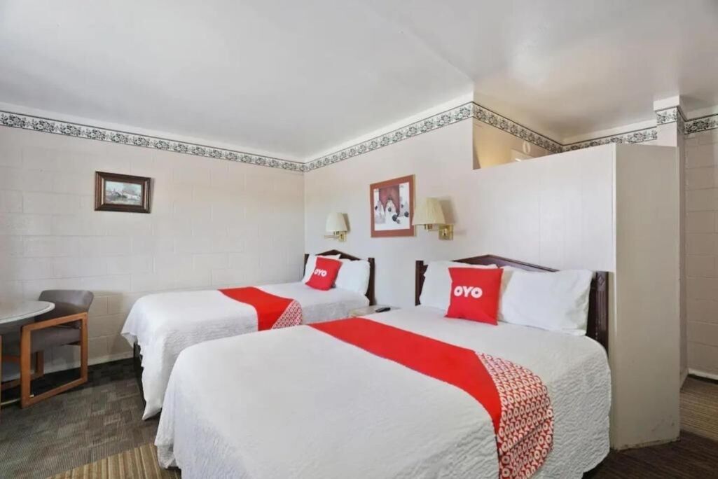Sink into crisp bedding and relax in a bright room.