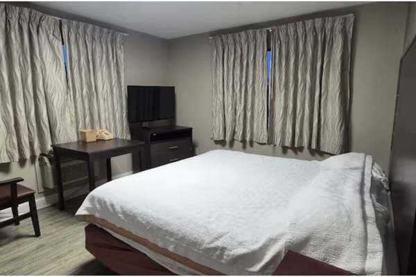 Stretch out and sleep soundly with blackout curtains drawn.