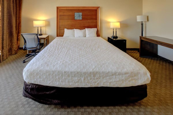 Sink into crisp linens for a restorative night’s sleep.