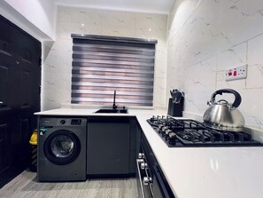 Comfort Apartment, Balcony, City View | Private kitchen | Fridge, microwave, oven, stovetop - Kim Thompson Shortlets (Abuja)